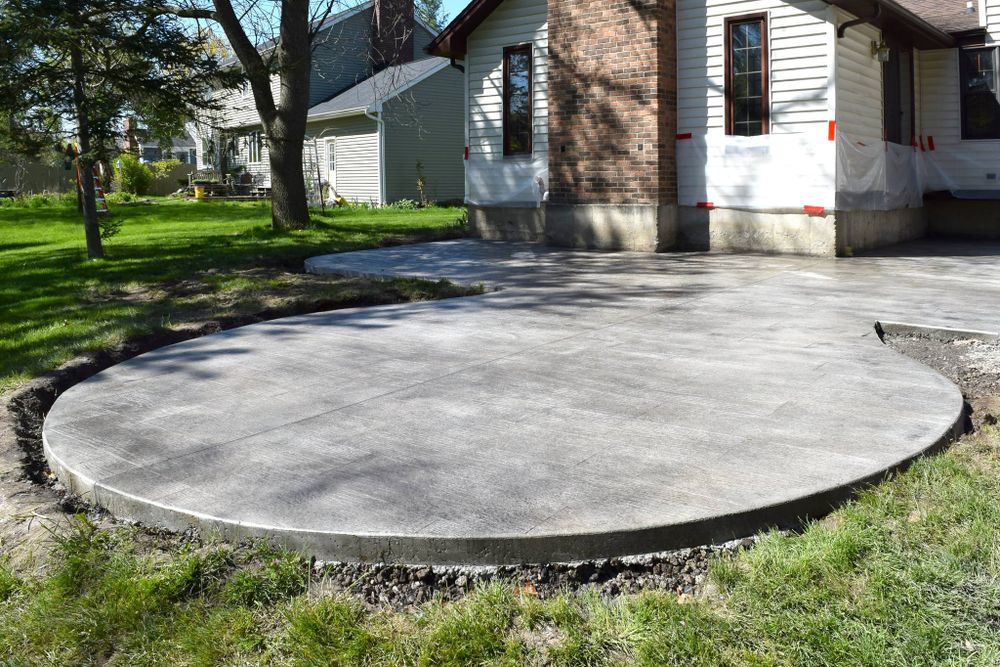 Transform your outdoor space with our expert Patio Design & Installation service, offering customized concrete solutions that enhance beauty and functionality for relaxation or entertaining. Durable, stylish patios tailored to your needs. for Harold's Construction in Howell, MI