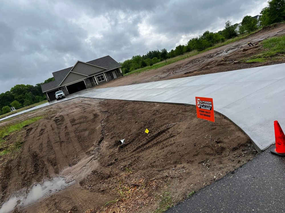Our driveway installation services provides our customers with durable and aesthetically pleasing concrete driveways, enhancing curb appeal and ensuring long-lasting functionality for your home. Trust our expert team for quality construction. for Outdoor Dynamics LLC in Sherburne County, MN