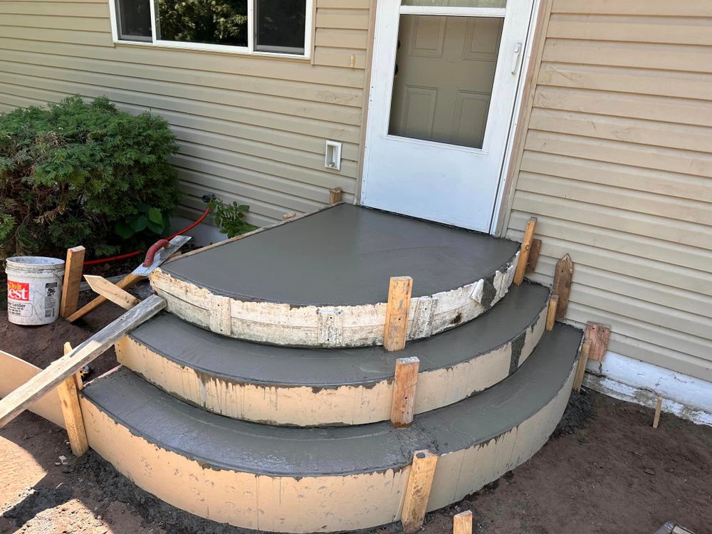 Our Stair Design & Installation service offers homeowners the opportunity to enhance their property with durable and visually appealing concrete stairs tailored to match their unique aesthetic preferences and structural needs. for Mccoy Concrete Inc.  in Buffalo, MN