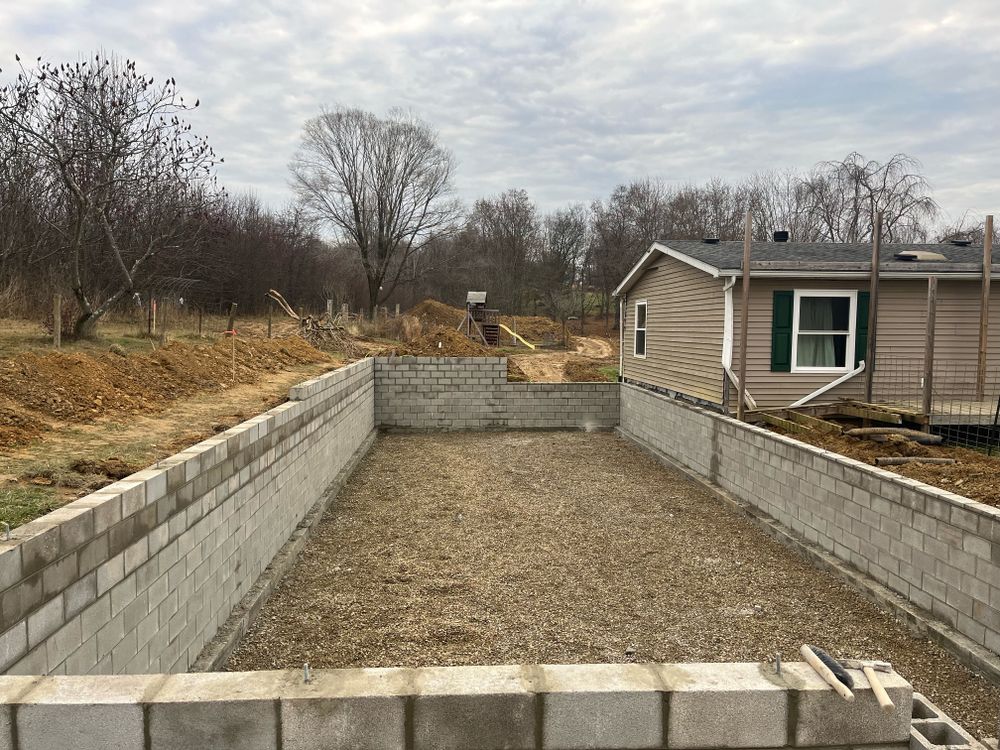 Our Concrete Foundation service provides homeowners with a solid and durable base for their homes, ensuring stability and longevity in the construction. for Shamblin Masonry & Restoration in Columbus, Ohio
