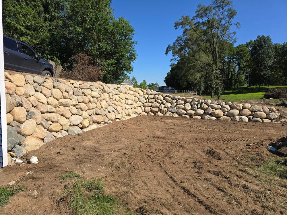 Enhance your outdoor space with our expert retaining wall construction service, providing stability and beauty. Tailored to your needs, we ensure long-lasting durability and functionality for any landscape design. for Michiana Boulders Landscaping & Excavating in Union, MI