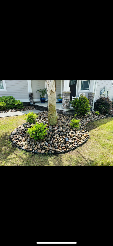 Enhance your landscape with professional mulch and rock installation. We offer decorative stone in a variety of styles and colors, along with premium double-hammered mulch to give your beds a clean, polished look. for New Creation Landscaping in Myrtle Beach, SC