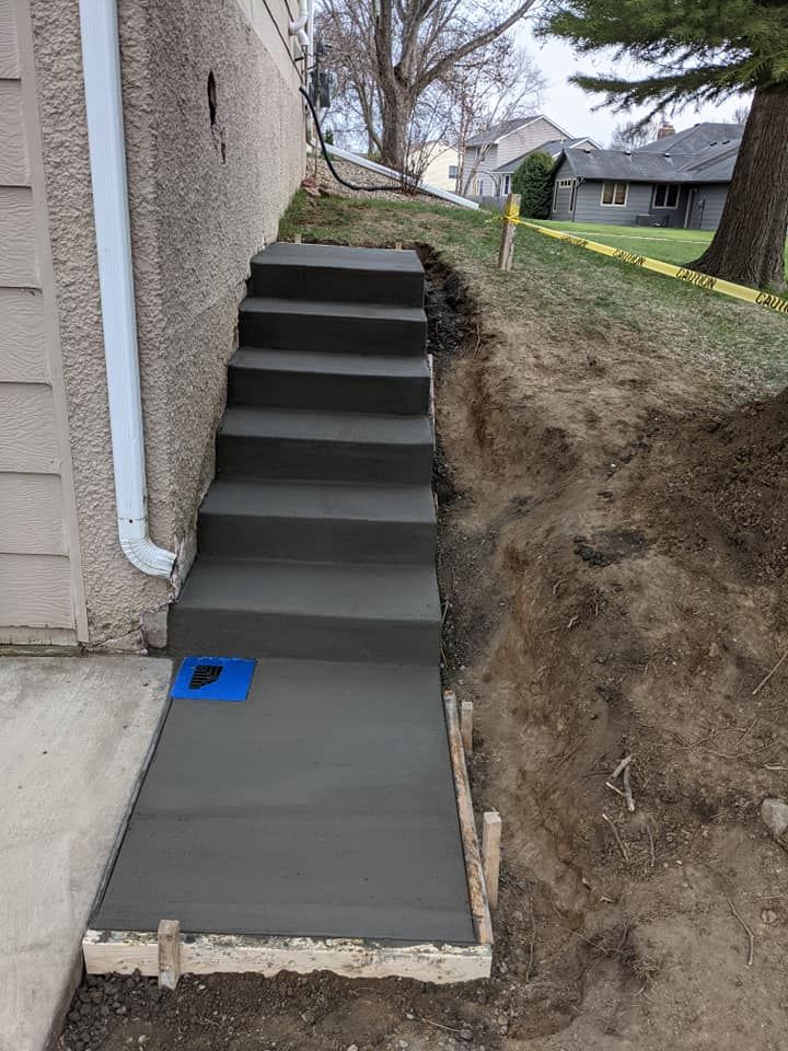 Our expert stair design and installation service transforms spaces with durable, stylish concrete solutions tailored to your home's aesthetic, ensuring safety and beauty in every step you take. for Six Diamonds Concrete in Mounds View, MN
