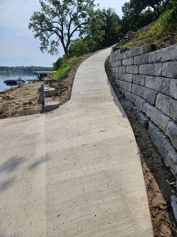 Enhance your home's curb appeal with our professional sidewalk installation service; we ensure durability and aesthetics using high-quality materials for a safe and welcoming walkway tailored to your needs. for New Age Concrete in Perry, IA