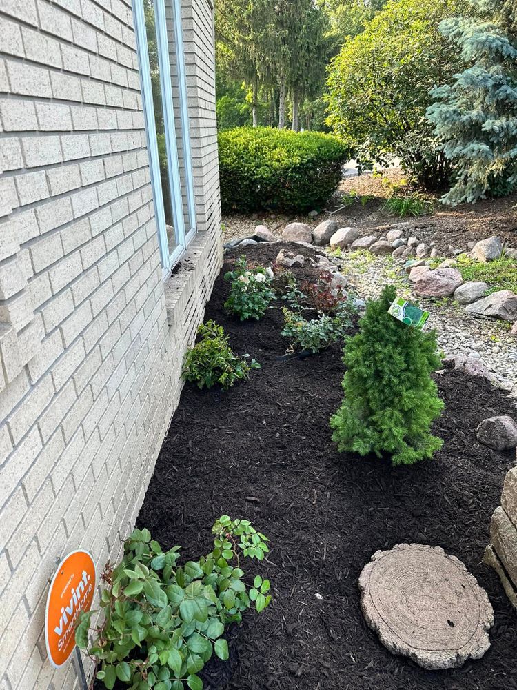 Our Mulch Installation service includes spreading quality mulch around your garden and landscape to help retain moisture, suppress weed growth, improve soil health, and enhance the overall appearance of your property. for Torres Lawn & Landscaping in Valparaiso, IN