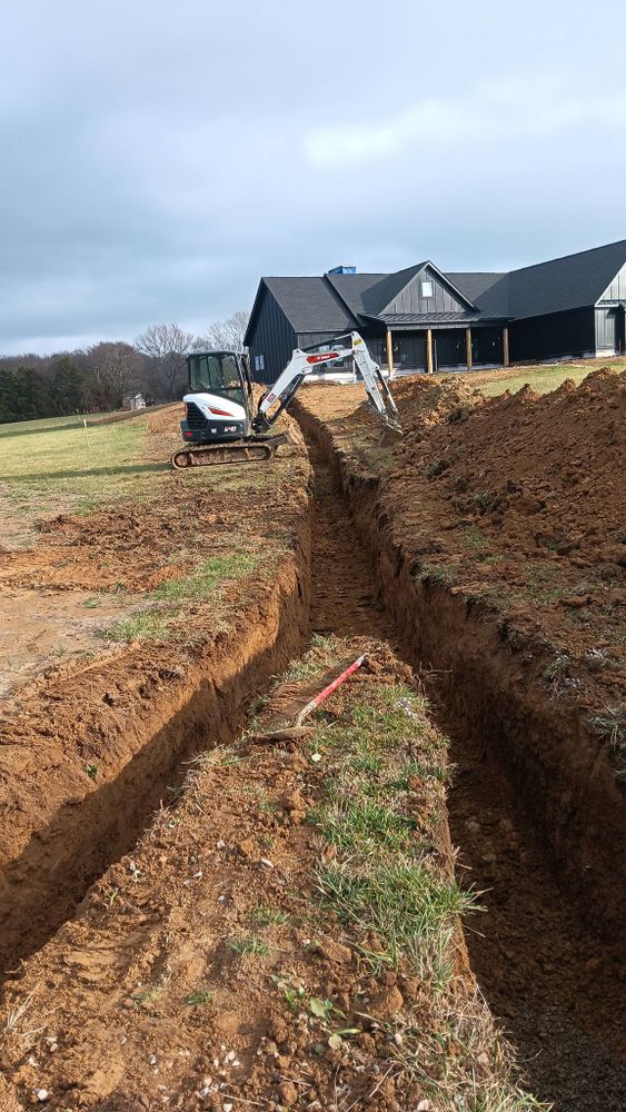Our expert excavating contractor team provides precise trenching and excavation services, ensuring safe and efficient groundwork for utilities installation or landscaping projects, tailored to enhance your home's functionality and aesthetic appeal. for Yates Construction & Excavation in Arrington, Tennessee