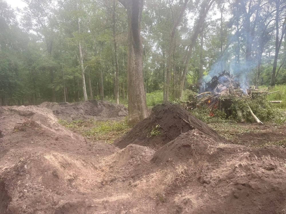 Our leveling service ensures your property's terrain is expertly flattened and prepared, providing a stable foundation for construction, landscaping, or drainage projects. Trust our skilled team for reliable and precise results. for Ewc Land Clearing and more in Lake Park, GA