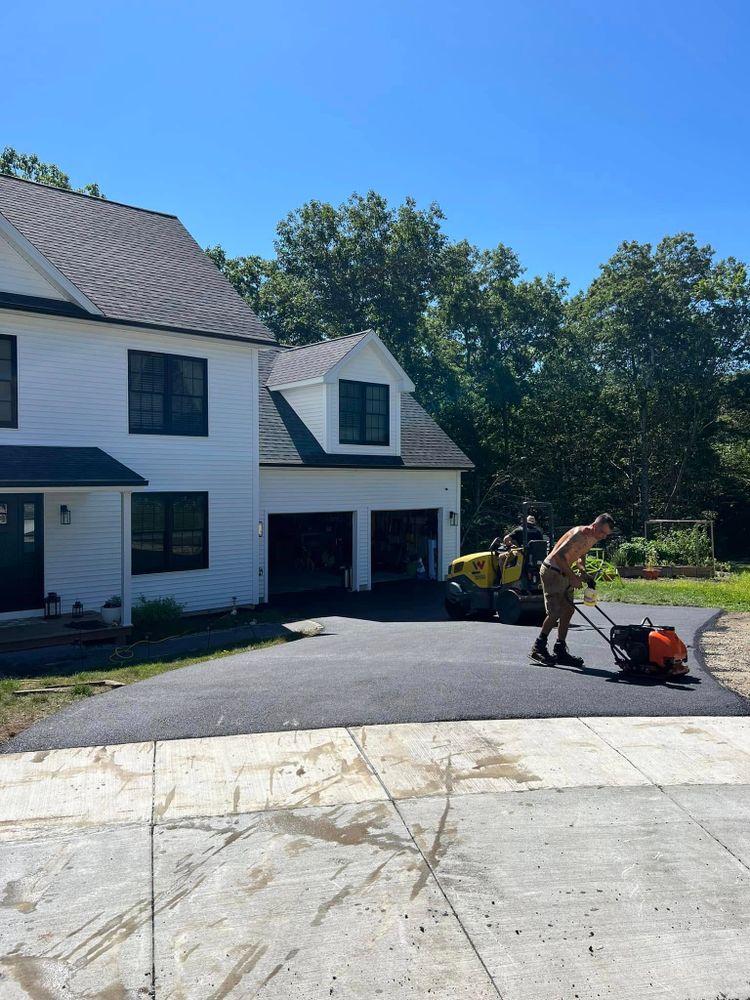 Enhance your home's curb appeal with our Driveway Construction service, featuring expert patio design & construction for a seamless blend of functionality and elegance in your outdoor spaces. for Cardinal Landworks LLC in Canterbury, CT