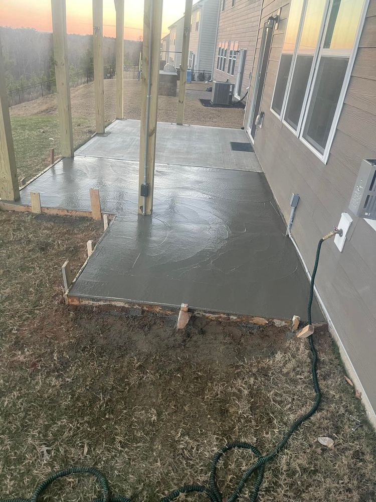 Enhance your home's stability with our expert concrete slab construction. Our services complement retaining wall construction, providing a solid foundation and durable landscape solutions tailored to meet your home improvement needs. for Simmons Masonry & Concrete in Charlotte, NC