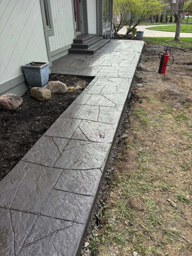 Our stamped concrete installation service offers homeowners an attractive and durable solution, enhancing outdoor spaces with versatile designs that mimic natural stone or wood, providing an affordable aesthetic upgrade for your property. for Davies Concrete and Construction in Columbus, OH