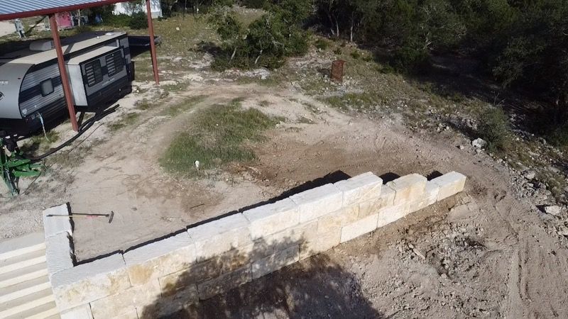 Limestone blocks retaining wall  for De Leon Carpentry & Renovation  in Leakey, TX