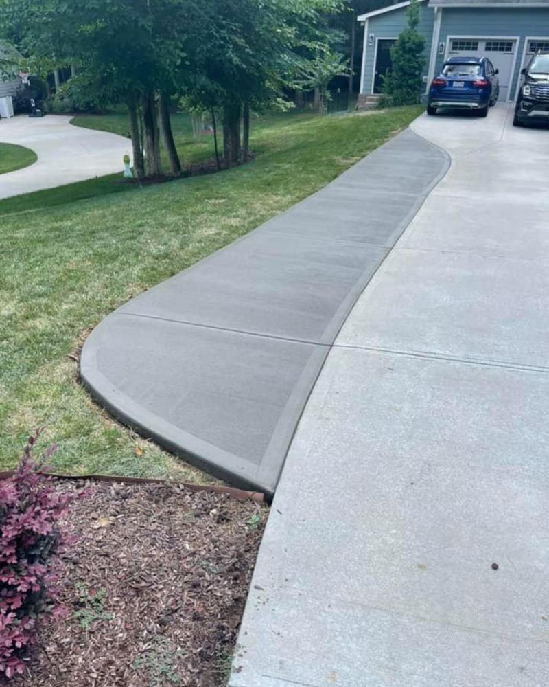 Our concrete driveway installation service offers precise, step-by-step installation services ensuring durability and aesthetic appeal. Trust our masonry expertise for a seamless experience that enhances your home's exterior with lasting quality. for Simmons Masonry & Concrete in Charlotte, NC