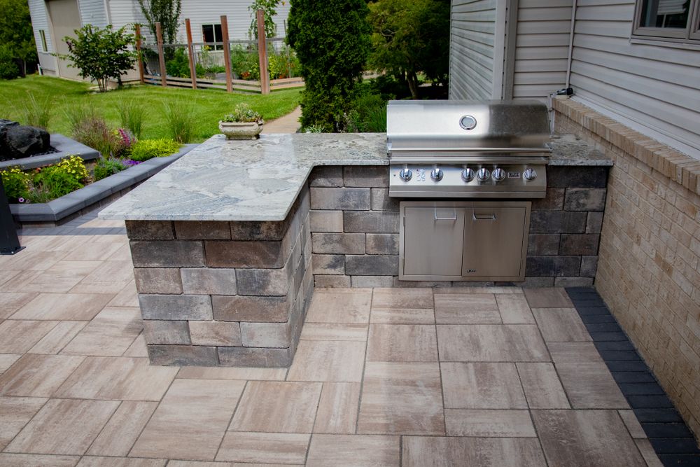 Elevate your home with a luxury outdoor kitchen by Sunstone Construction. Serving Wixom & Metro Detroit, MI, we design and build custom outdoor kitchens with 3D renderings, premium materials, and timeless craftsmanship. for Sunstone Construction in Oakland County, MI