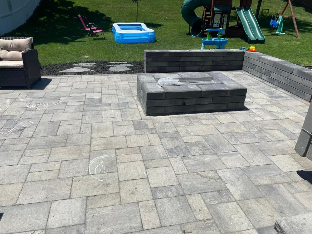 Our Paver Patios service offers homeowners a stylish and durable solution for enhancing their outdoor living spaces, providing them with a beautiful and functional area to relax or entertain guests. for Hardscapes of Nebraska in Arlington, NE