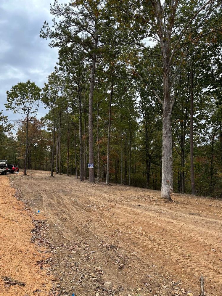 Our Roadbeds service ensures stable and durable foundations for driveways or private roads, enhancing safety and longevity by expertly preparing the ground with precision excavation tailored to your property's unique needs. for Green Land Management in Mount Pleasant, TN