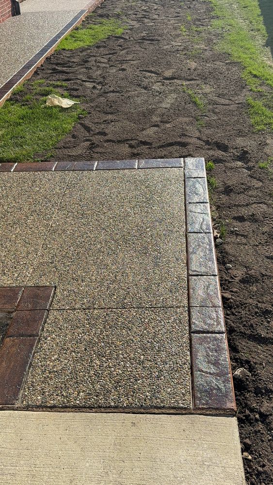 "Crown Cement Specializes." In concrete. Walkways and custom layouts for your outdoor living. From exposed aggregate finishes to stamp concrete, there are numerous color options. We service "All Dom River." Canton, Plymouth, and Livonia. for Crown Cement in Canton Township, MI