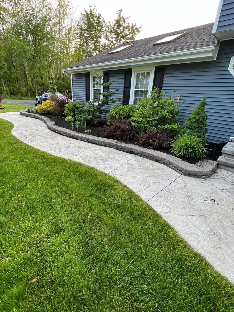 Our hardscape installation service designs and builds durable patios, walkways, retaining walls, and outdoor living features that enhance your home's beauty, functionality, value, and long-term enjoyment with expert craftsmanship. for HVQ Landscaping in Albany,  NY