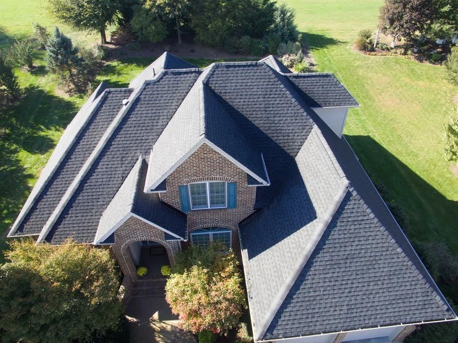 Upgrade your home with our metal roofing service, providing durability, energy efficiency, and modern aesthetics. Trust us to protect your new construction with top-quality materials and expert installation. for New Vision Construction Company in Fort Wayne, IN