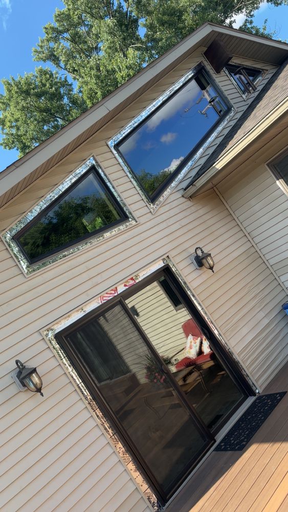 Enhance your home's beauty and energy efficiency with our expert window installations, complementing our comprehensive deck & patio installation services to create seamless indoor-outdoor living spaces tailored to your lifestyle. for Kingdom Carpentry in Jackson, MI