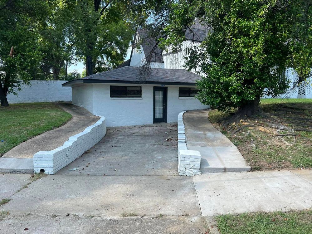 Our retaining wall construction service enhances your landscape's functionality and aesthetics by preventing soil erosion, offering structural support, and blending seamlessly with your outdoor space using durable concrete solutions. for Sam's Concrete & Masonry in Hernando, MS