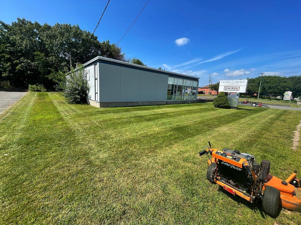 Our expert mowing service ensures a perfectly manicured lawn, enhancing your home's curb appeal with precision cuts and tailored care designed to promote healthy grass growth and vibrant greenery all year round. for Blades of Glory LLC in Cheshire, CT