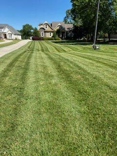 Our professional mowing service provides precise and efficient lawn maintenance, ensuring your yard always looks neat and well-kept. Enjoy a beautifully manicured lawn without the hassle of upkeep. for Dream Cuts Landscaping and Lawn Care LLC in Gastonia, NC