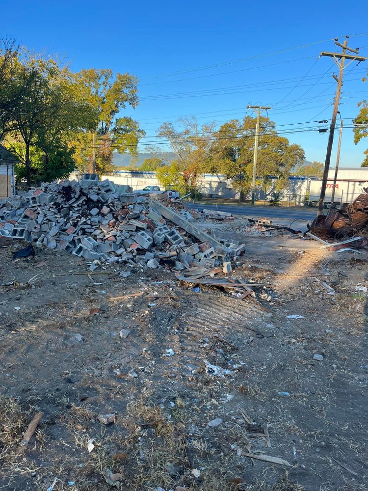 Our Debris Removal service efficiently clears construction waste, yard debris, and unwanted materials, ensuring a clean site. We prioritize safety and eco-friendly disposal methods for residential properties of all sizes. for J.P Landscaping and excavation in Chattanooga, TN