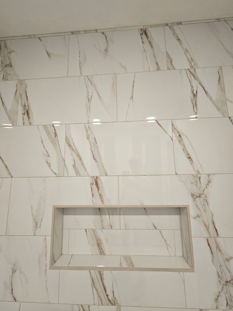 Enhance your bathroom with our expert custom shower tiling services. We offer tailored designs and precise installations, adding elegance and functionality to your space with quality craftsmanship. Transform your shower today! for Fulford Carpet and Tile in Holden Beach, NC