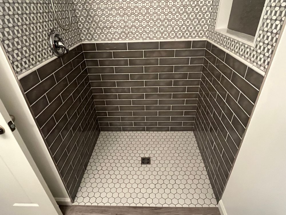 Tile showers and tub surrounds for Chapman Surfaces Tile & Remodeling in Milan, MI