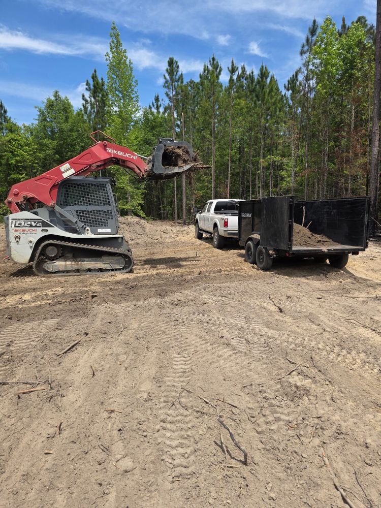 Our Land Clearing service efficiently removes trees, shrubs, and debris from your property, creating a clean slate for new projects while ensuring safety and environmental responsibility for homeowners. Transform your landscape effortlessly. for Page Outdoor Services in Wrightsville, GA