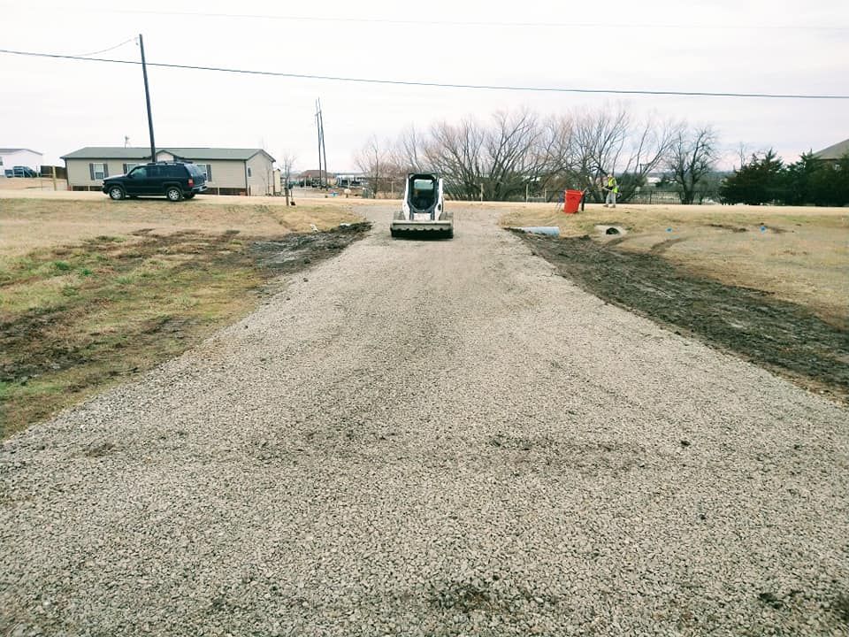 Our Grading Leveling Terrain service provides precise land contouring to ensure proper drainage, prevent erosion, and create a stable foundation for your landscaping needs, enhancing both beauty and functionality of your outdoor space. for Lavon Lawn Plus in Lavon, TX
