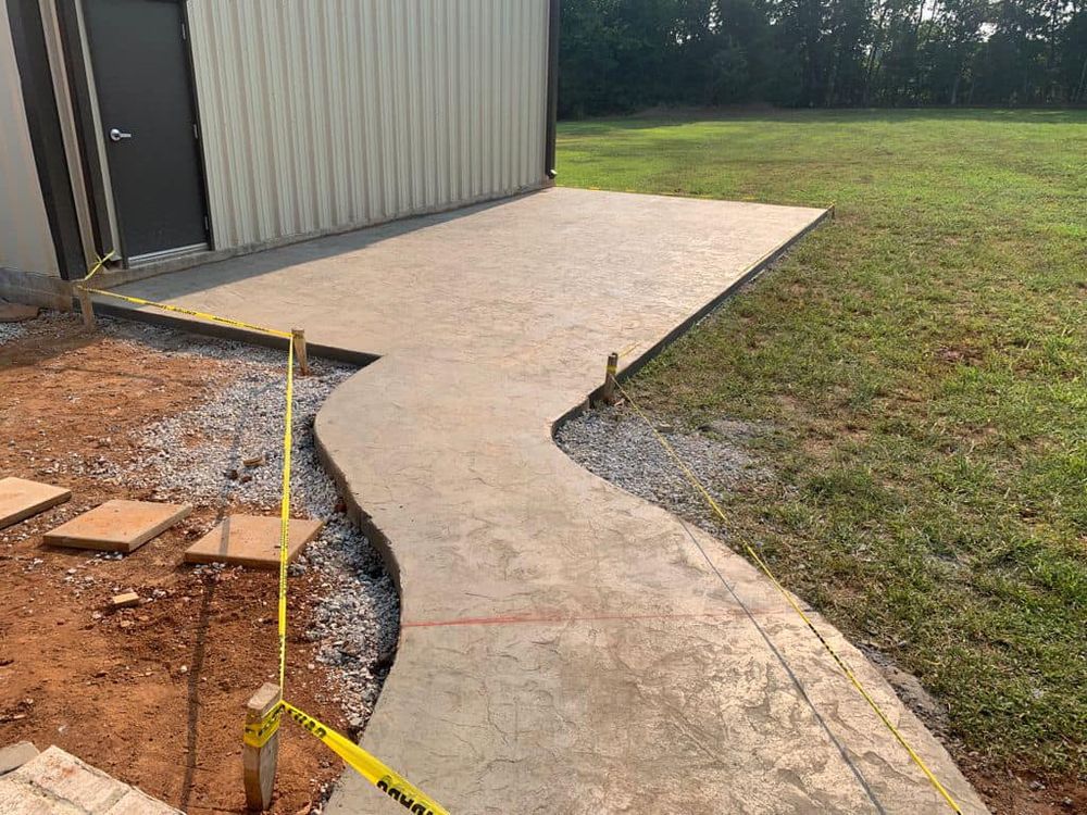 Enhance your home with our expert sidewalk installation service, providing durable, aesthetically pleasing concrete pathways designed to complement your exterior and ensure safety, longevity, and curb appeal for any property. for Henry's Construction in Nashville, TN