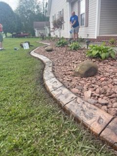 Enhance the beauty and organization of your outdoor space with our Landscape Curbing service. Professionally installed borders provide clean lines, define flower beds, and add curb appeal to your property. for Dust Till Dawn Lawn in London, Kentucky