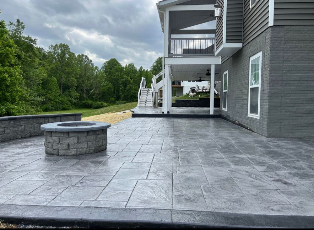 If you're looking to improve your outdoor living space, our stamp concrete service is perfect for you. We can help design and build a patio or sidewalk that perfectly fits your needs and style. for Keyes Exteriors in Stafford, VA