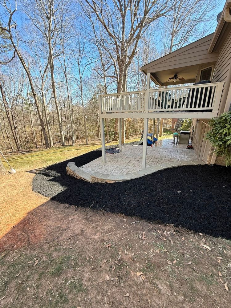 Enhance your garden's beauty and health with our professional mulch installation service, providing protection against weeds and retaining soil moisture while adding a polished look to your landscape. for Stars & Stripes Landscaping in Catawba, NC