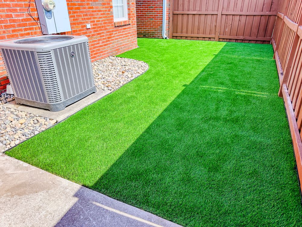 Enhance your home's outdoor appeal with our artificial turf grass, providing a lush, low-maintenance landscape solution that combines beauty and durability for year-round enjoyment without the hassle of natural lawn care. for Nature Tones Landscaping & Hardscaping in Hampstead, NC