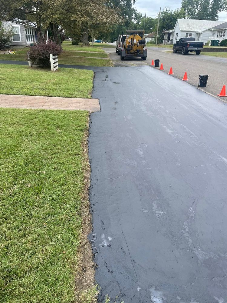 Enhance your driveway's longevity with our expert patching services. We swiftly repair cracks and potholes in asphalt surfaces to restore safety and appearance while preventing further damage to your property. for Heady Seal Coating in Sturgis, KY
