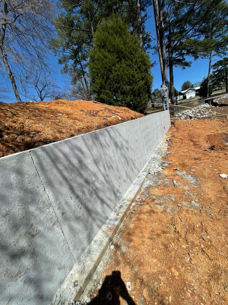 Our Retaining Walls & Seawalls service is designed to protect your property from erosion and flooding, ensuring the stability and longevity of your landscape with high-quality concrete solutions. for Stillwell Earthworks in Trussville, AL