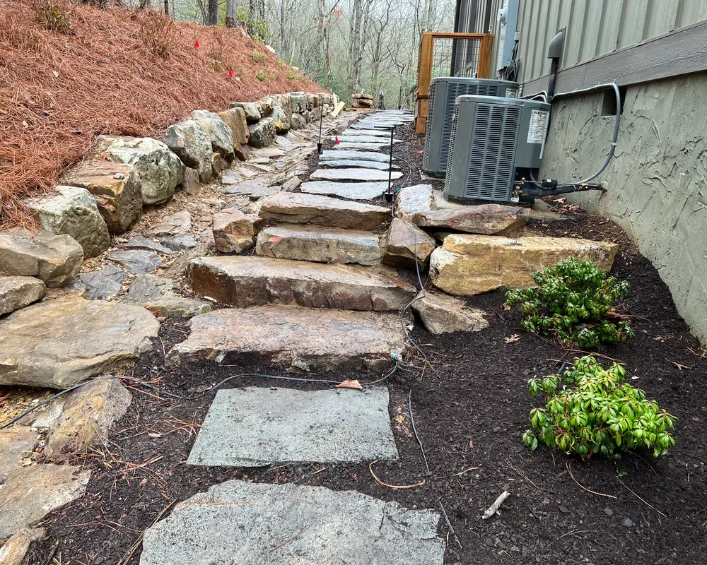 Transform your outdoor space with our expertly installed flagstone hardscaping. Our skilled team will create a visually stunning and durable foundation for your landscaping, enhancing the beauty and value of your home. for Rescue Grading & Landscaping in Marietta, SC