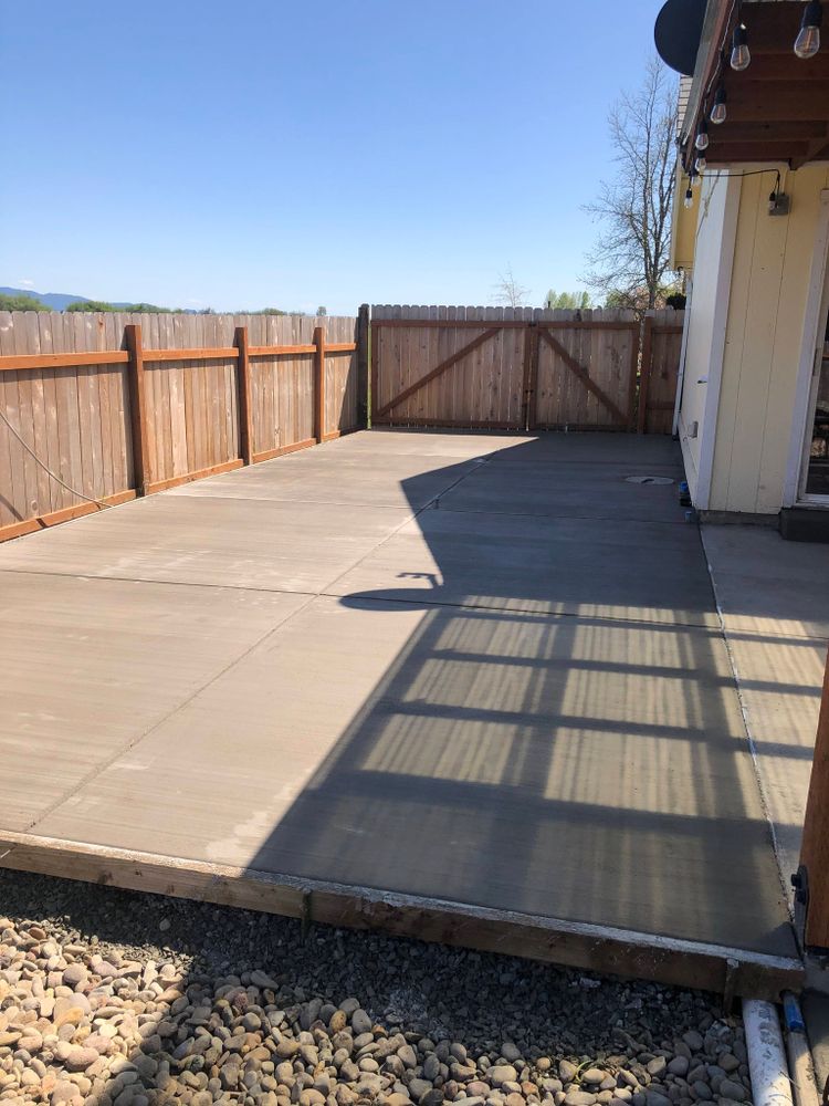 Our Concrete Flatwork service offers precise concrete placement for enclosed spaces, ensuring durable foundations and smooth finishes that perfectly complement your property's fencing needs, enhancing both functionality and aesthetic appeal. for Ranch Handy Fencing & Cattle LLC in Harrisburg, OR