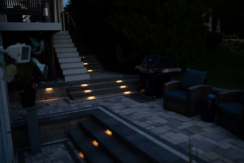 Enhance your outdoor space with our expert landscape lighting services, providing beauty, safety, and functionality. Transform your home's exterior into a stunning nighttime showcase that highlights architectural features and garden elements. for Sunstone Construction in Oakland County, MI