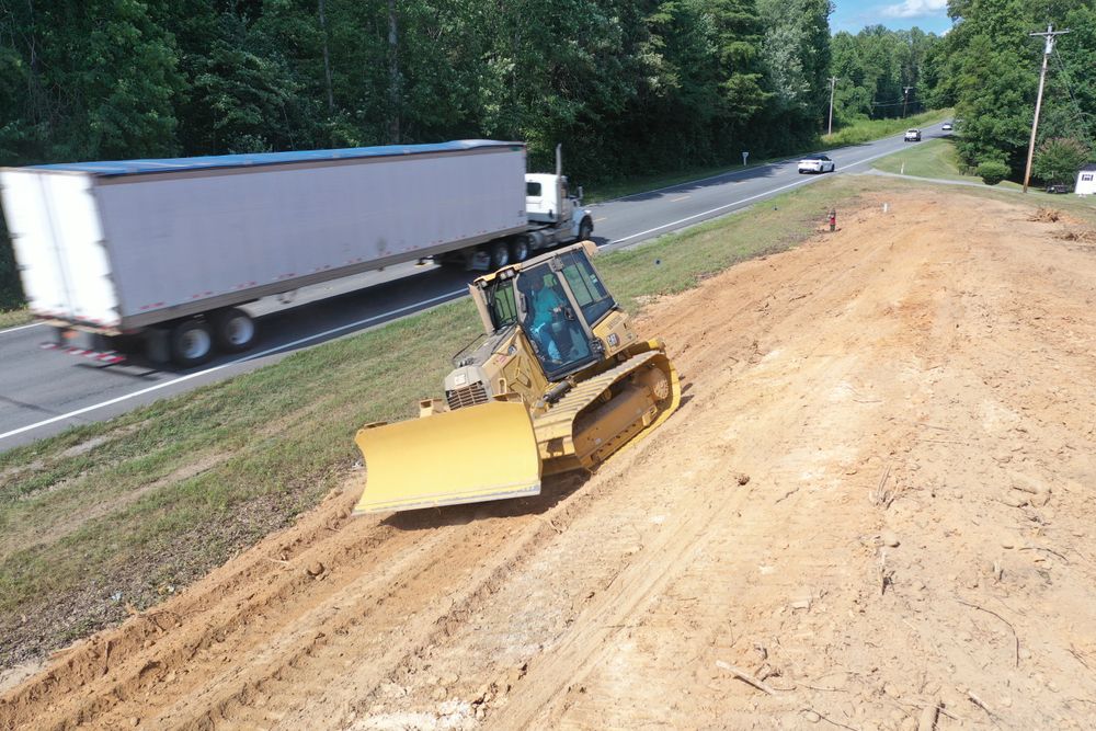 Our grading system ensures precise leveling of your land, optimizing drainage control for a sturdy foundation. Trust us to transform your property into a safe, functional, beautiful landscape with ease. for Cone Grading and Land Clearing in Summerfield, NC