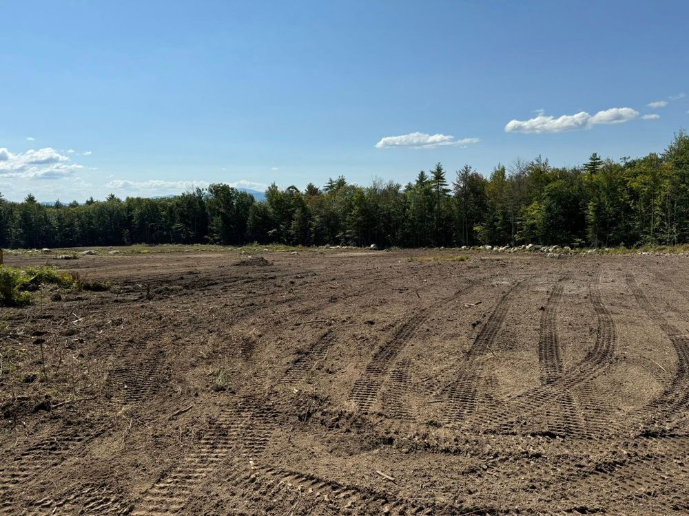 Our Land Grading service ensures a balanced landscape, improving drainage and preparing the site for construction or landscaping. Trust us to create an even surface that enhances your property's functionality and appearance. for AFH Earthworks in Madison, NH