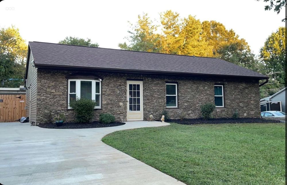 Enhance your home's beauty with our expert stone facades service. Transform any exterior by adding a stunning stone wall that combines durability and elegance, creating an inviting and timeless aesthetic. for Smith’s Custom Brick & Stone in Greensboro, NC