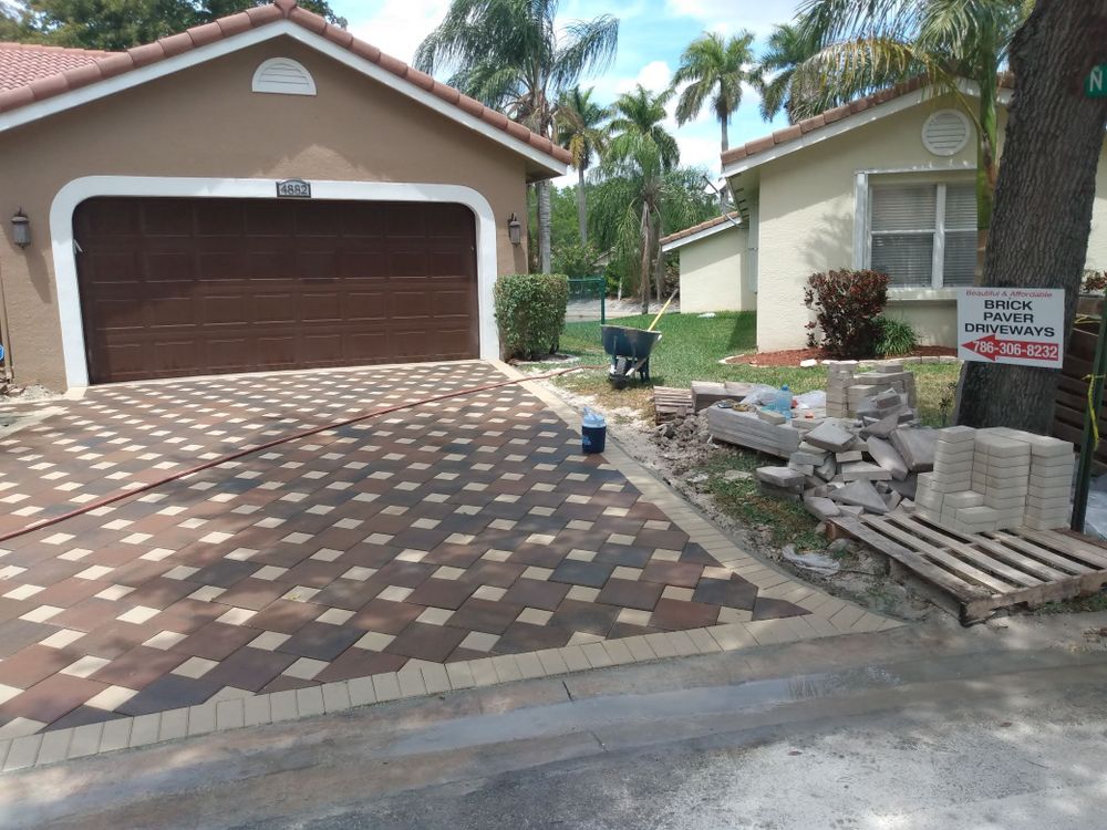 Transform your outdoor space with our professional brick pavers installation service, offering durability and stunning aesthetics. Enjoy customized designs tailored to enhance your home's beauty and increase its overall value. for Beautiful and Affordable Stamped Concrete by Castilla Concrete Finish Design Corp in Sunrise, FL