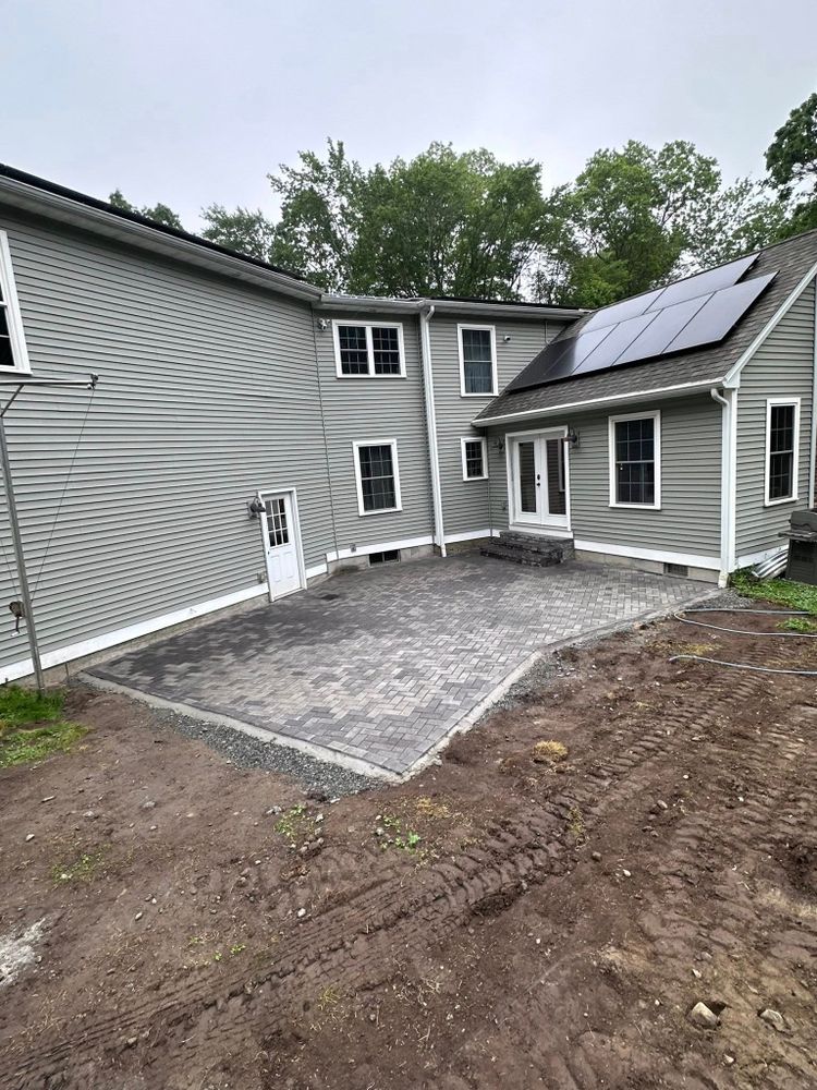 Enhance your outdoor living space with our expert patio design & construction services, tailored to blend functionality and style for the perfect backyard retreat that complements your home. for Cardinal Landworks LLC in Canterbury, CT