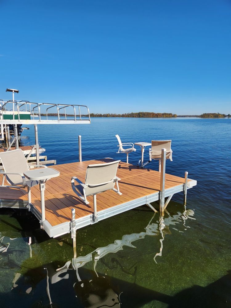 Enhance your outdoor space with our expert Docks service, providing custom design and installation for durable, stylish docks that seamlessly integrate into your landscape while offering convenience and increased functionality. for Northern Ridge Landscape - Dock & Lift Service in McGregor, MN