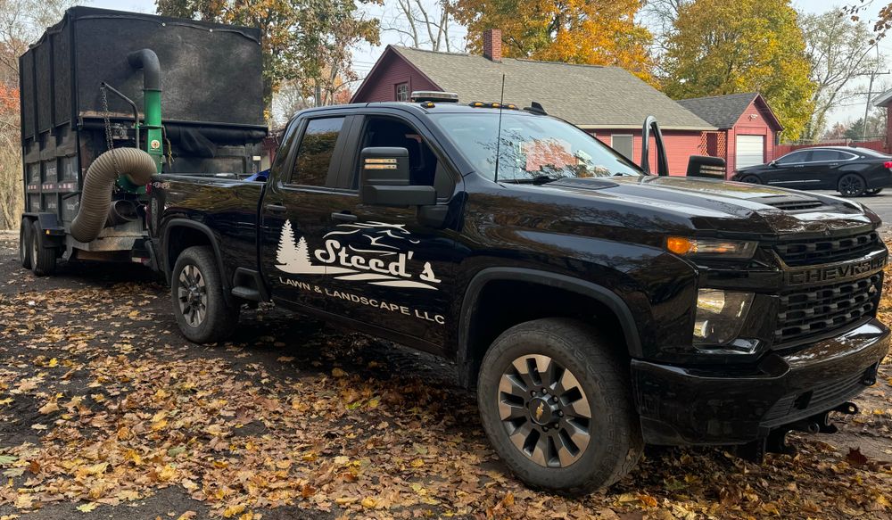 Our Fall Clean Up service ensures a pristine lawn by removing leaves, debris, and dead plants, preparing your yard for winter while enhancing aesthetics and promoting healthy growth in the spring. for Steed's Lawn and Landscape LLC in White Lake, MI