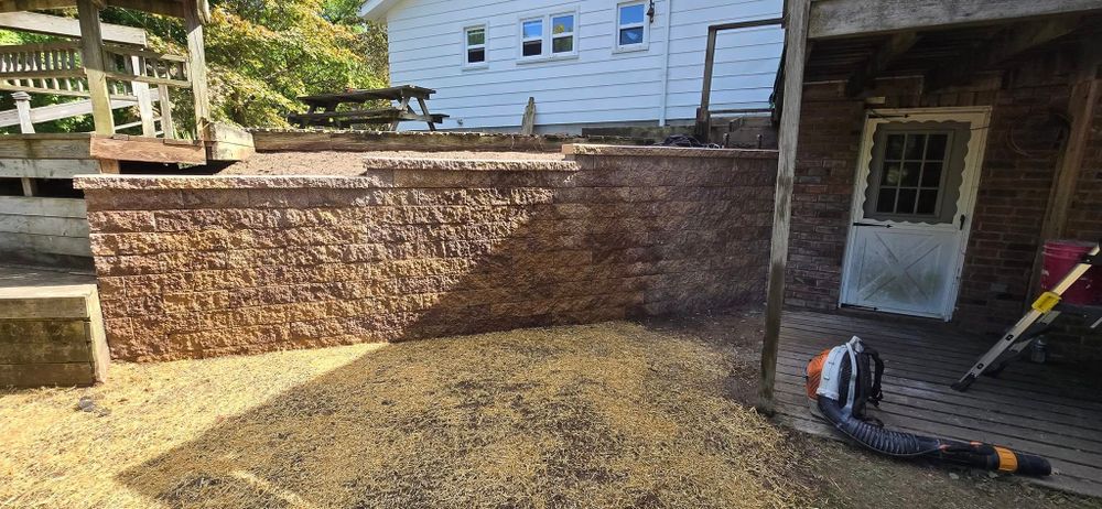 Our retaining wall construction service offers durable, aesthetically pleasing solutions to enhance your landscape, prevent soil erosion, and maximize space utilization, ensuring stability with expert craftsmanship tailored to your home's unique needs. for Best One Hardscapes in Brooklyn, MI