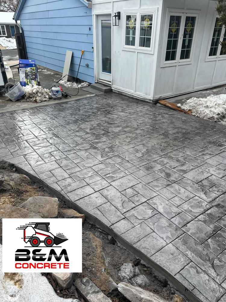Transform your outdoor spaces with our expert stamped concrete installation service, offering durable and stylish designs that mimic natural stone or brick, enhancing the beauty and functionality of your home environment. for B&M Concrete LLC in Longmont, CO